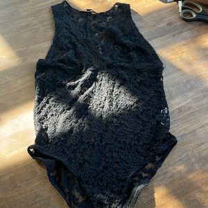 Sexy lace body suit size large button closure at the bottom.